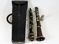 An early 20thC. Hawkes & Son rosewood clarinet
