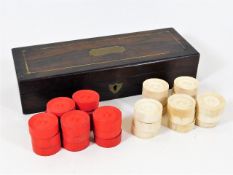 A 19thC. set of bone draughts, one piece missing of each colour with rosewood case