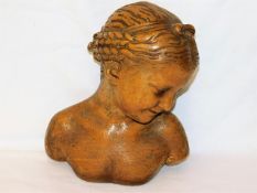 An early 20thC. plaster bust of young woman