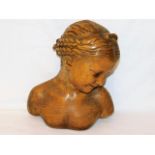 An early 20thC. plaster bust of young woman