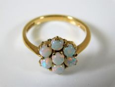 A 9ct gold opal daisy ring