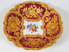 A Meissen bowl with gilded decor in relief framing