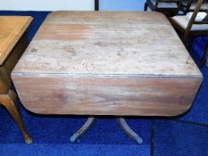 A period Regency mahogany table with brass feet &
