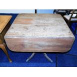 A period Regency mahogany table with brass feet &