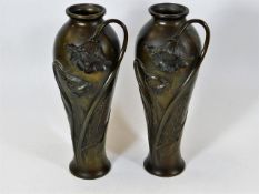A pair of French bronze art nouveau vases