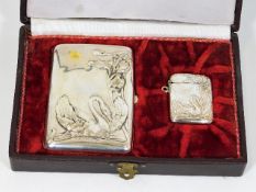 A boxed silver cigarette & vesta case with art nou