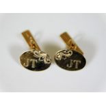 A pair of 9ct gold cufflinks with inscription