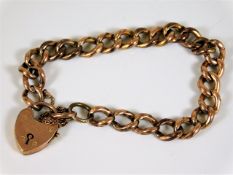 A 9ct gold curb bracelet with padlock