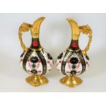 A pair of Royal Crown Derby Old Imari 1128 ewers