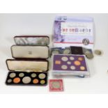 Three boxed sets of UK coinage twinned with other