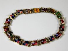 A 9ct gold bracelet with enamelled flags