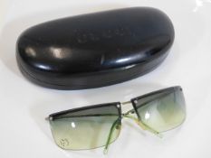 A ladies pair of Gucci sunglasses