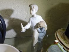 A Lladro figure of two boys