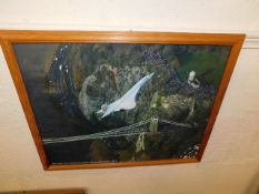 A framed picture of Corncorde over Clifton Bridge,