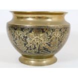 An antique decorative brass Asian bowl