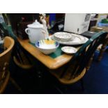 An extending tiled kitchen table with four chairs