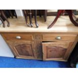 An early 20thC. sideboard with drawers & cupboard