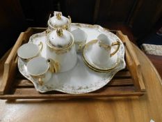 A vintage tray twinned with porcelain tea set