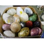 A quantity of fifteen polished stone eggs includin