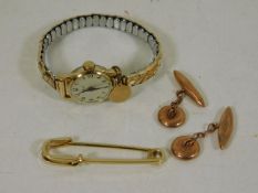 A set of 9ct gold cufflinks, a yellow metal pin &
