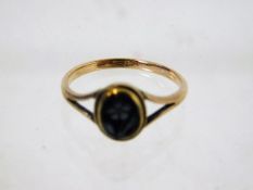A 9ct gold hardstone cameo ring