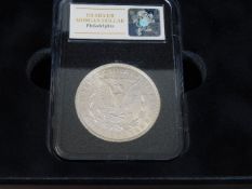 A silver US Morgan Dollar