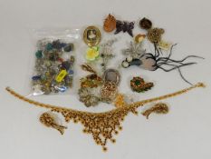 A quantity of costume jewellery including amber ea