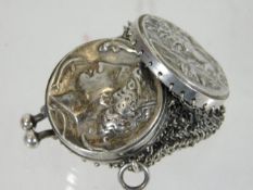 A white metal sovereign holder