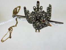 A 19thC. silver bird brooch encrusted with diamond