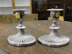 A pair of silver plated candlesticks