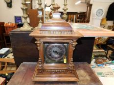 A c.1900 wooden mantle clock with brass face