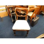 A Victorian dining chair twinned with art deco lam