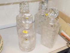 Three matching cut glass decanters & one other, mi