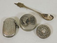 A silver vesta case, a silver spoon, a silver lid