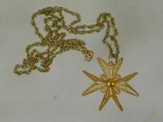 A 9ct gold chain with 18ct gold filigree work star