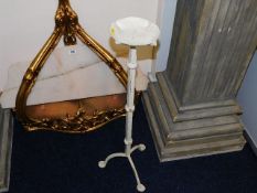 A tall metal candle stand