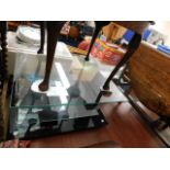 A modern two tier glass coffee table