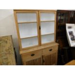An antique stripped pine kitchen dresser