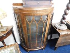 A mid 20thC. glazed display cabinet