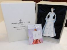 A boxed Doulton figurine Occasions