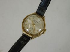A ladies small yellow metal watch with yellow meta