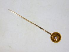 A 15ct gold tie pin set with diamond
