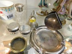 A silver bell, three silver topped jars & an art d