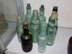 Eight antique glass lemonade bottles