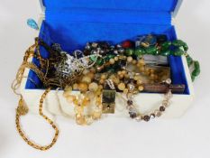 A boxed quantity of costume jewellery