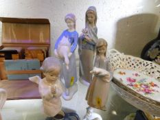 Four small Lladro & Nao figures, one chipped