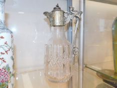 A 19thC. cut glass claret jug with ornate handle,