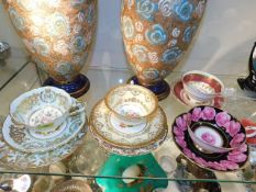 Four decorative cups & saucers