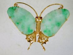 A 14ct gold butterfly brooch with jade wings set w