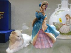 A Doulton figurine twinned with cat